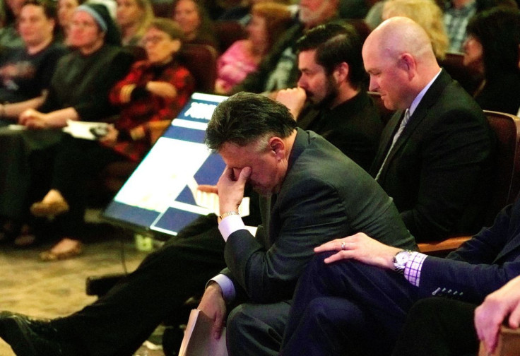 Former Columbine principal Frank DeAngelis cries as he is introduced at a Columbine 20th  anniversary remembrance service, held two days ahead of the anniversary of the school shooting, at Waterstone Community Church in Littleton, Colorado, U.S. April 18,