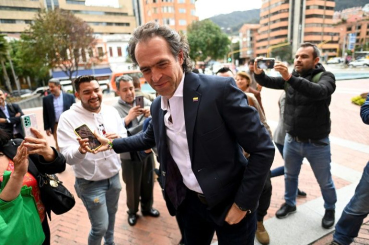 Federico Gutierrez, representing an alliance of right-wing parties in Colombia's presidential election, is greeted by supporters after speaking at a press conference in Bogota on May 25, 2022