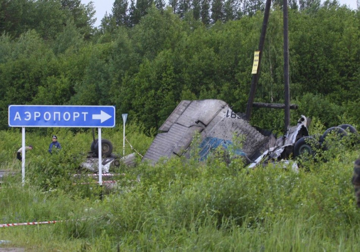 Personnel from the Russian emergency services work at the site of a plane crash outside Petrozavodsk