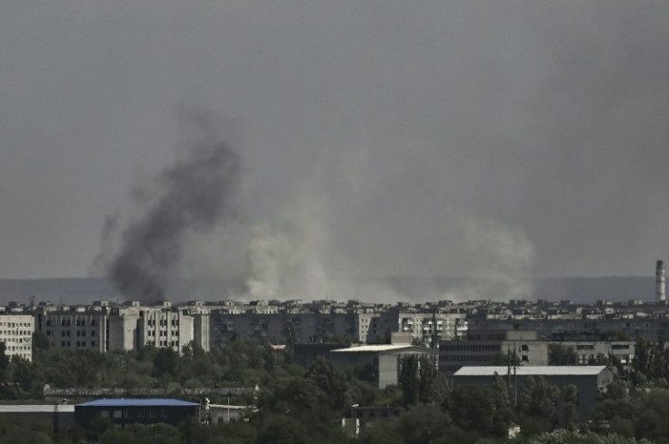 Ukraine's besieged industrial city of Severodonetsk is shrouded in smoke from battles raging across its destroyed streets