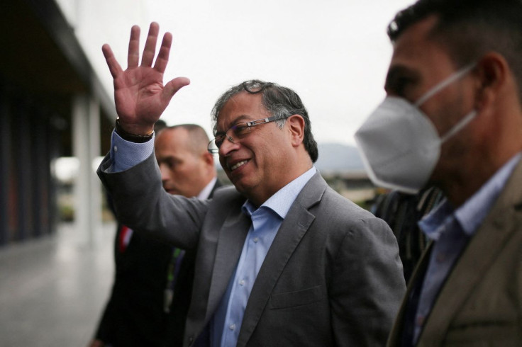 Colombian left-wing presidential candidate Gustavo Petro, of the Historic Pact coalition, waves as he arrives to a debate in Bogota, Colombia May 26, 2022. 