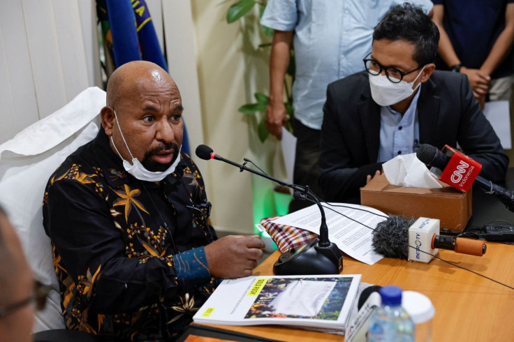 Papua Governor Lukas Enembe speaks next to the Executive Director of Amnesty International Indonesia Usman Hamid during a meeting in Jakarta, Indonesia, May 27, 2022.