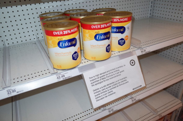 Cans of Enfamil baby formula, produced by Mead Johnson, on partially empty shelves in a Target store, amid continuing nationwide shortages in infant and toddler formula, in San Diego, California, U.S., May 25, 2022.  