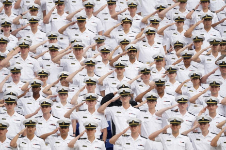 Underclass midshipmen salute during the national anthem at the U.S. Naval Academy graduation and commissioning ceremony in Annapolis, Maryland, U.S., May 27, 2022.  