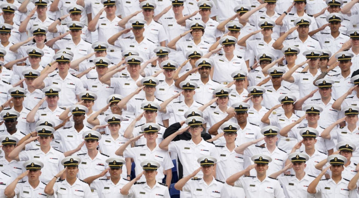 Underclass midshipmen salute during the national anthem at the U.S. Naval Academy graduation and commissioning ceremony in Annapolis, Maryland, U.S., May 27, 2022.  