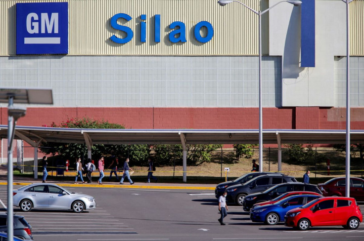 Workers arrive for a shift at the GM truck assembly plant amid the outbreak of the coronavirus disease (COVID-19), in Silao, Mexico May 22, 2020.