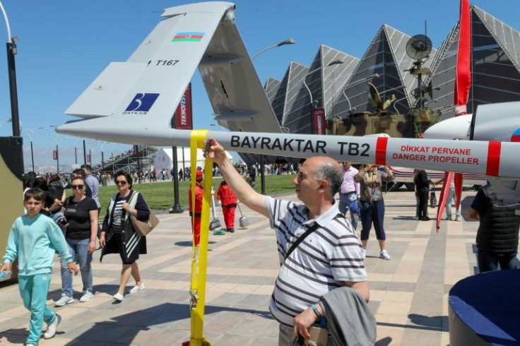 Azerbaijani audience members at the aviation festival applauded during a display of TB2 drones