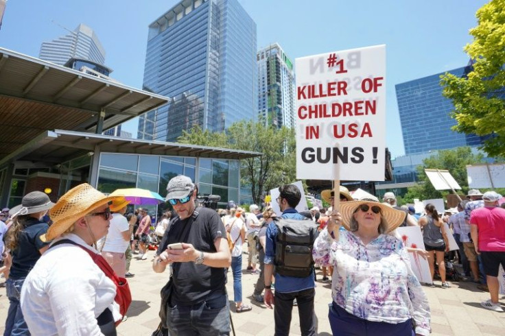 Demonstrators protest outside the National Rifle Association Annual Meeting at the George R. Brown Convention Center  in Houston, Texas on May 27, 2022