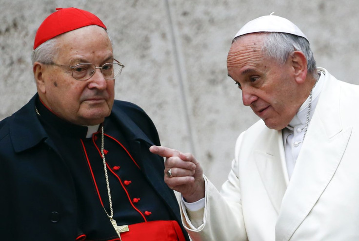 Pope Francis talks with Cardinal Angelo Sodano as they arrive to attend a consistory at the Vatican February 13, 2015.