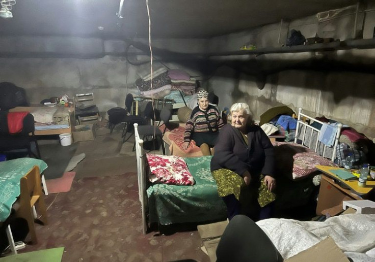 The beds are lined up in three large rooms where most residents are elderly women in the underground shelter in Kutuzivka village