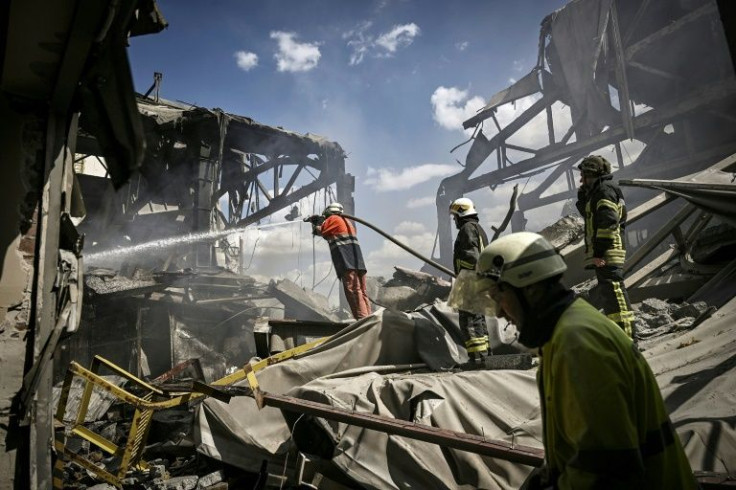 Firemen extinguish a blaze at a factory shelled in Bakhmut in the eastern Ukrainian region of Donbas where Russia is pressing an offensive