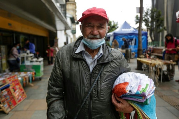 Carlos Caisedo, 78, says he has no state support and has to sell rags on the street in order to eat and have a bed for the night