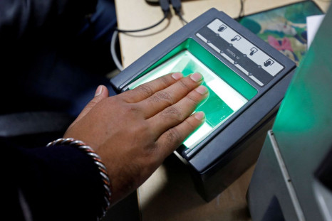 A woman goes through the process of finger scanning for the Unique Identification (UID) database system, also known as Aadhaar, at a registration centre in New Delhi, India, January 17, 2018. 