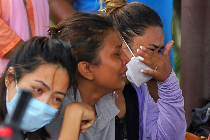 Family members and relatives of passengers on board the missing plane wept outside Pokhara airport
