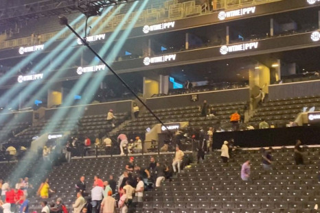 People escape from the tribunes after a false shooting alert inside Barclays Center in New York, U.S., May 28, 2022 in this screen grab obtained from a social media video. Ryan Songalia/via REUTERS  
