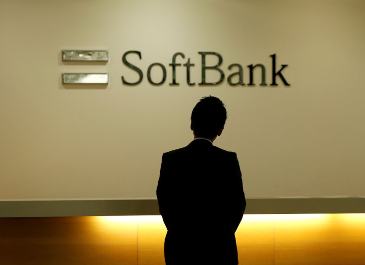 A man looks at the logo of SoftBank Group Corp at the company's headquarters in Tokyo, June 30, 2016.   