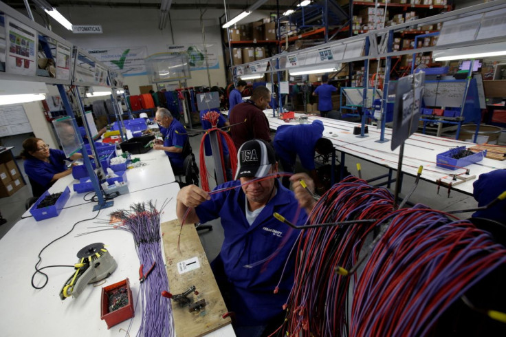 Employees work at a wire harness and cable assembly manufacturing company that exports to the U.S., in Ciudad Juarez, Mexico, April 27, 2017.
