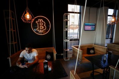 A neon logo of cryptocurrency Bitcoin is seen at the Crypstation cafe, in downtown Buenos Aires, Argentina May 5, 2022. 