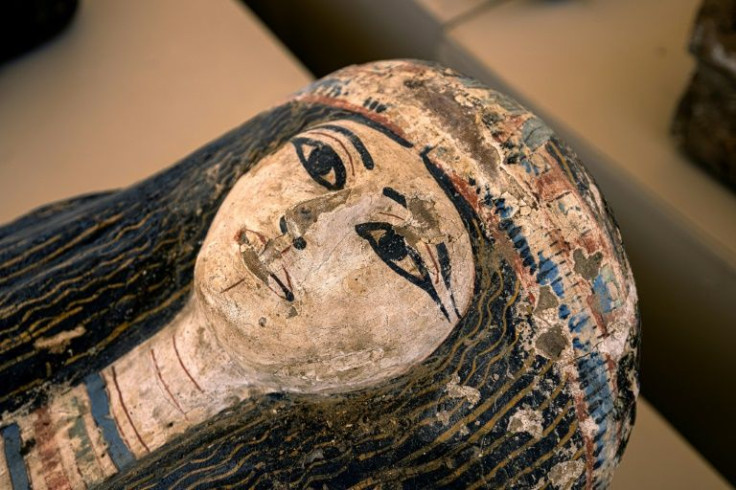 The face on one of the 250 wooden sarcophagi dating to the Egyptian Late Period, around the fifth century BC), discovered at the Saqqara necropolis