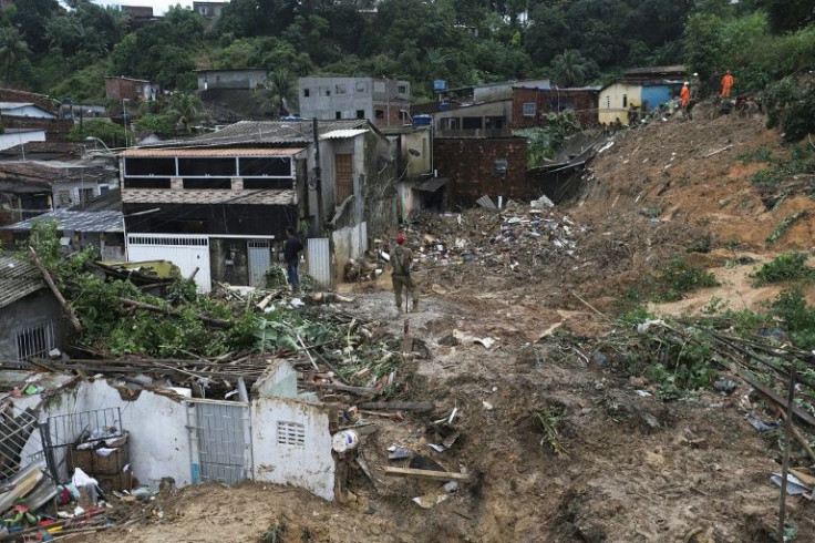 Experts say heavy rains in Brazil are now being augmented by climate change, with poor neighborhoods, especially hillside 'favelas,' or slums, hit hardest