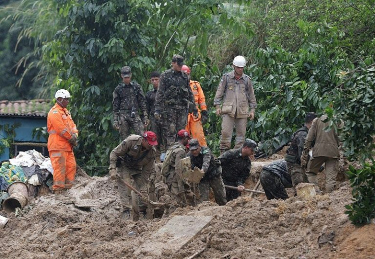 Emergency workers are still digging through the ocean of muck in the Jardim Monteverde neighborhood on the outskirts of Pernambuco state capital Recife, as clean-up crews clear the streets