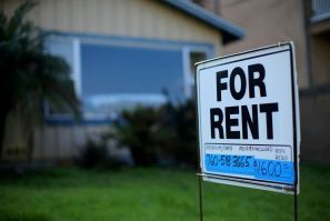 A "For Rent" sign is posted outside a residential home in Carlsbad, California, U.S. on January 18, 2017.  