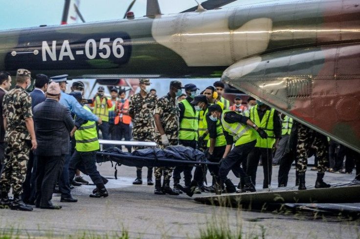 Nepali rescuers have retrieved the bodies of all 22 people from a plane that crashed into a Himalayan mountainside