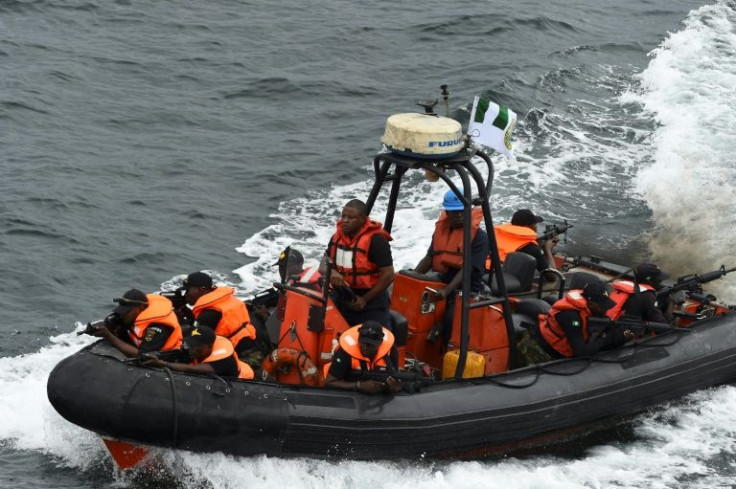 Special forces of the Nigerian navy sail to apprehend pirates in a mock operation during joint exercises with France in Nigerian waters in October 2019