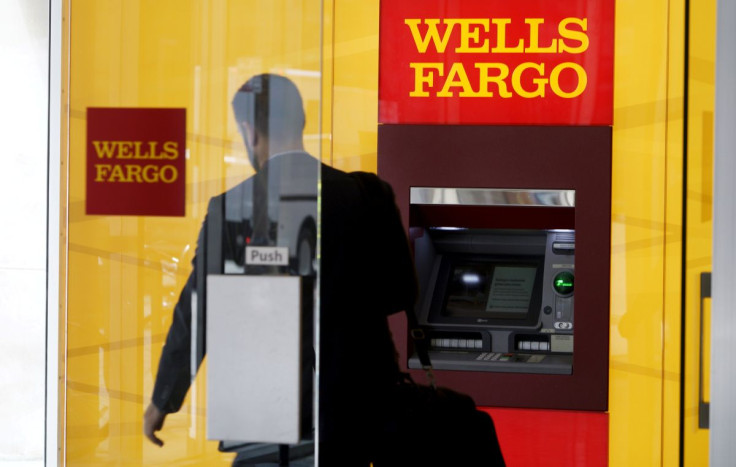 A man walks by an ATM at the Wells Fargo & Co. bank in downtown Denver April 13, 2016.  