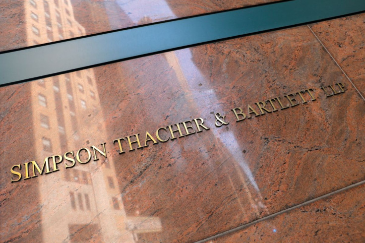 Signage is seen on the building exterior of the law firm Simpson Thacher & Bartlett LLP in Manhattan, New York City, U.S., August 17, 2020.