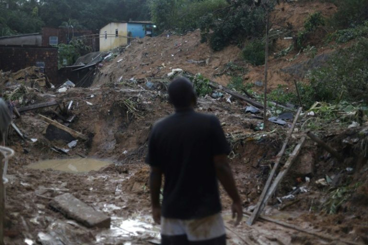 A man looks at the site of a landslide in the community of Jardim Montes Verdes in Recife, in the state of Pernambuco, Brazil, on May 31, 2022