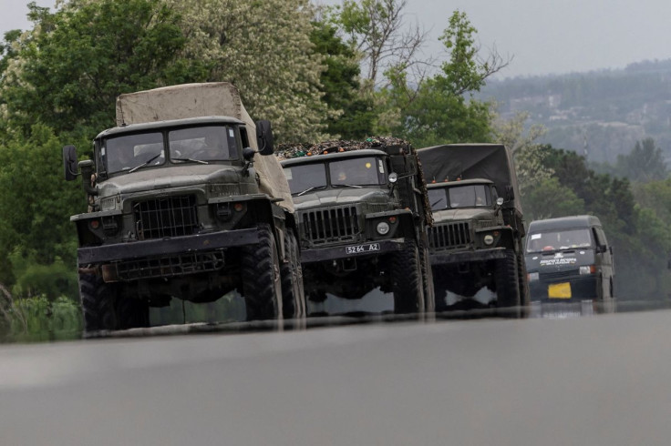 Military vehicles are see moving along a road, amid Russia's invasion of Ukraine, in the Donetsk region, Ukraine, May 31, 2022 
