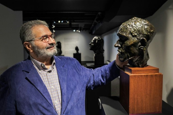 Midas touch: Erbil Arkin, the head of the Arkin group of casinos in northern Cyprus, admires a bust by the great French sculptor Auguste Rodin, one of many he owns
