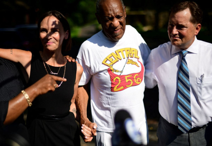Bill Cosby is welcomed outside his home after Pennsylvania's highest court overturned his sexual assault conviction and ordered him released from prison immediately, in Elkins Park, Pennsylvania, U.S., June 30, 2021.  At left is lawyer Jennifer Bonjean. 