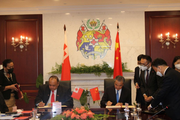 China's Foreign Minister Wang Yi and Tonga's Prime Minister Siaosi Sovaleni sign agreements during Wang Yi's official visit to the country, in Nuku'alofa, Tongatapu, Tonga May 31, 2022. Picture taken May 31, 2022. Tonga Prime Minister's Office/Handout via