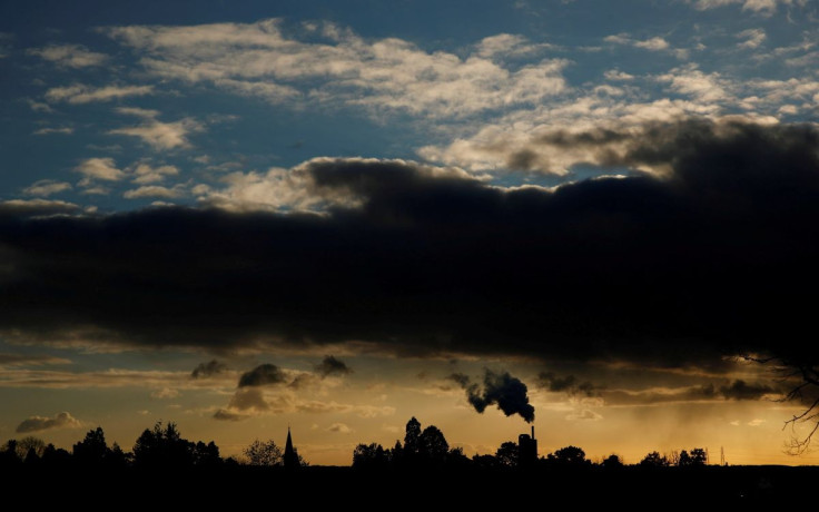 Smoke rises above a factory at sunset in Rugby, Britain February 10, 2021. 