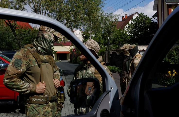 Members of the Crimea battalion, a Ukrainian army unit made up mostly of Crimean Tatar Muslims, prepare to leave for training, as Russia's attacks on Ukraine continues, in Kyiv, Ukraine May 28, 2022. Picture taken May 28, 2022. 