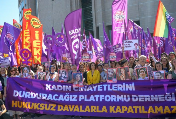 Protesters waved banners bearing slogans such as 'You will never walk alone!' outside the court Wednesday