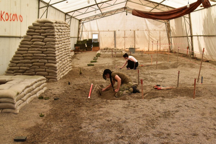 A woman takes part in a training on the removal of landmines and other unexploded ordnances, held for a group of Ukrainians including civilians and army officers, amid Russia's invasion of Ukraine in Peja, Kosovo, May 31, 2022. Picture taken May 31, 2022.