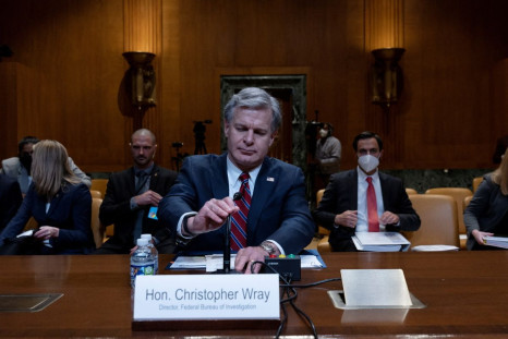 Federal Bureau of Investigation Director Christopher Wray prepares to testify in a hearing on the FY 2023 budget for the FBI held by the Commerce, Justice, Science, and Related Agencies Subcommittee on Capitol Hill in Washington, U.S., May 25, 2022. 