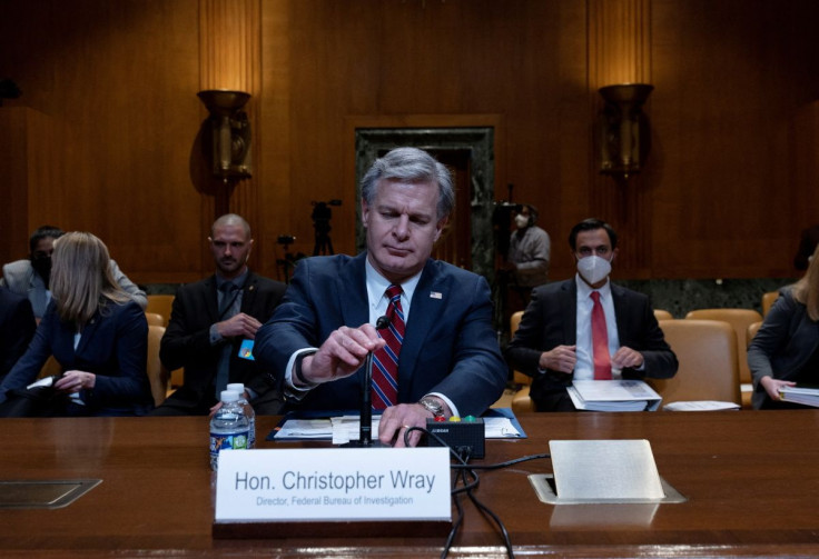 Federal Bureau of Investigation Director Christopher Wray prepares to testify in a hearing on the FY 2023 budget for the FBI held by the Commerce, Justice, Science, and Related Agencies Subcommittee on Capitol Hill in Washington, U.S., May 25, 2022. 