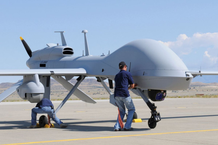 Workers prepare an MQ-1C Gray Eagle unmanned aerial vehicle for static display at Michael Army Airfield, Dugway Proving Ground in Utah in this September 15, 2011 US Army handout photo obtained by Reuters February 6, 2013.    