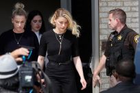 Amber Heard leaves Fairfax County Circuit Courthouse after the jury announced split verdicts in favor of both her ex-husband Johnny Depp and Heard on their claim and counter-claim in the Depp v. Heard civil defamation trial at the Fairfax County Circuit C