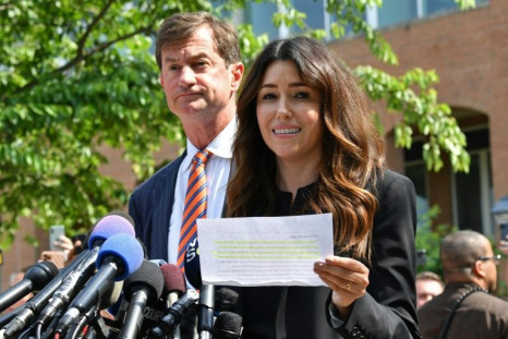 Johnny Depp's attorneys Ben Chew (L) and Camille Vasquez (R) read a statement following the verdict in his defamation trial against his ex-wife Amber Heard