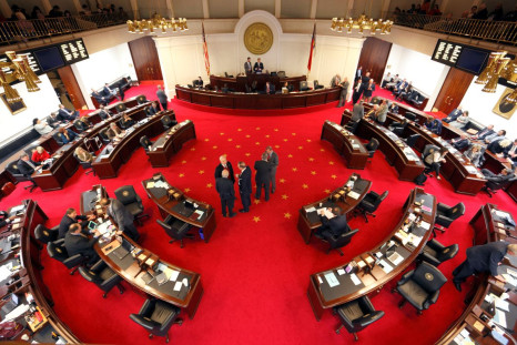 Lawmakers confer during a negotiations on the floor of North Carolina's State Senate chamber, North Carolina, U.S. December 21, 2016.  