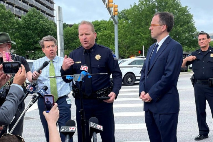 Tulsa Police Department Deputy Chief Eric Dalgleish (C) addresses reporters after a mass shooting at a St. Francis Health System hospital that killed at least four people, plus the gunman who was also dead