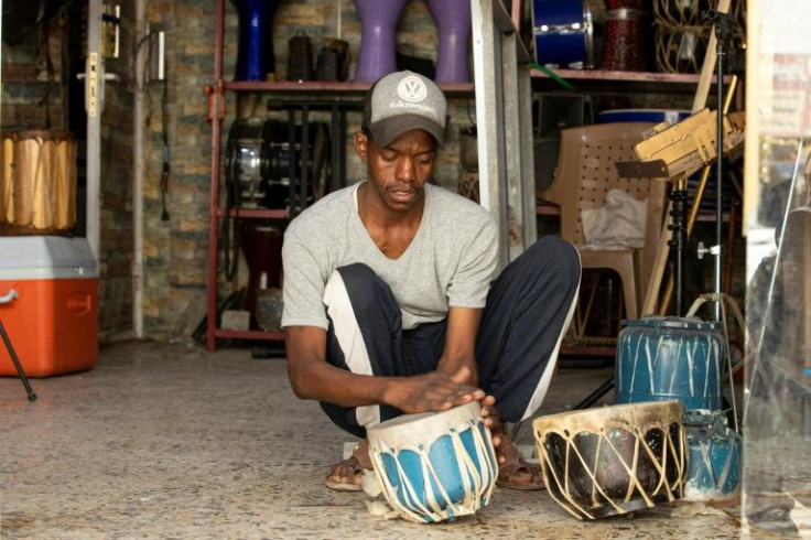 Khaled al-Dawsary, a maker of traditional drums such as the daf and tabla, at his workshop in the southern city of Zubair