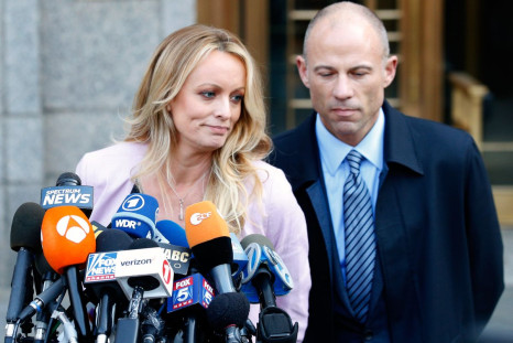 Adult film actress Stephanie Clifford, also known as Stormy Daniels, speaks to media along with lawyer Michael Avenatti (R) outside federal court in the Manhattan borough of New York City, New York, U.S., April 16, 2018. 