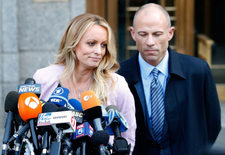 Adult film actress Stephanie Clifford, also known as Stormy Daniels, speaks to media along with lawyer Michael Avenatti (R) outside federal court in the Manhattan borough of New York City, New York, U.S., April 16, 2018. 