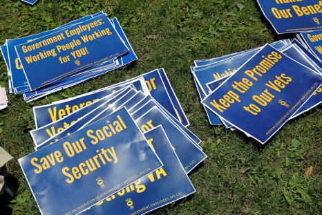 Signs are pictured on the ground during a noon-time rally of federal employees on Independence Mall to protest proposed cuts in federal funding in Philadelphia, Pennsylvania, U.S., June 22, 2017. 